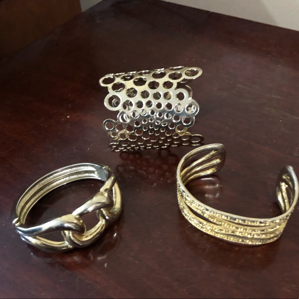 A Trio of Gold Tone Bracelets and Cuffs